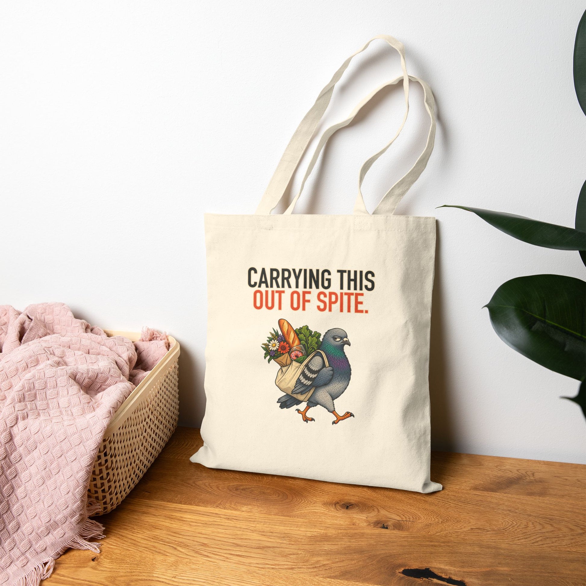 Carrying This Out of Spite Tote, natural canvas tote displayed in a home setting